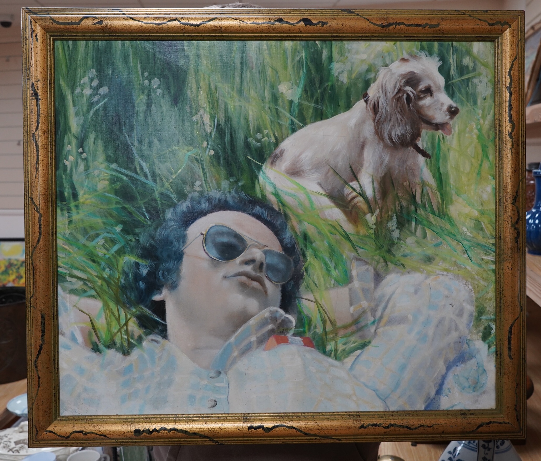 20th century, English School, oil on board, Figure lying in grass beside a dog, unsigned, 51 x 60cm. Condition - good